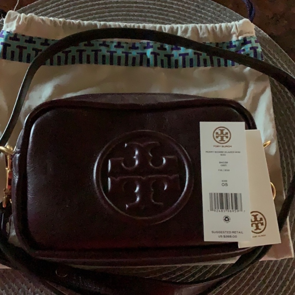 Purchased at Tory Burch store. Used only twice. Great travel or evening bag!